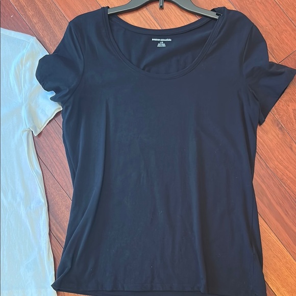 Women large Amazon tops in white and black. One top has a wider neckline. - Picture 2 of 14